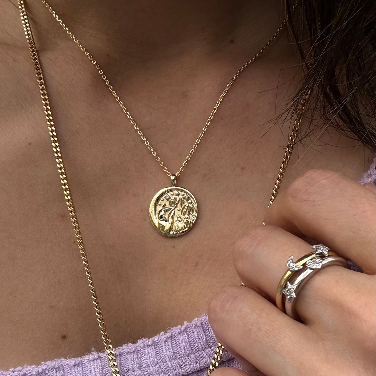  Woman wearing Sophie's Flowers 14k gold coin pendant layered with gold chains